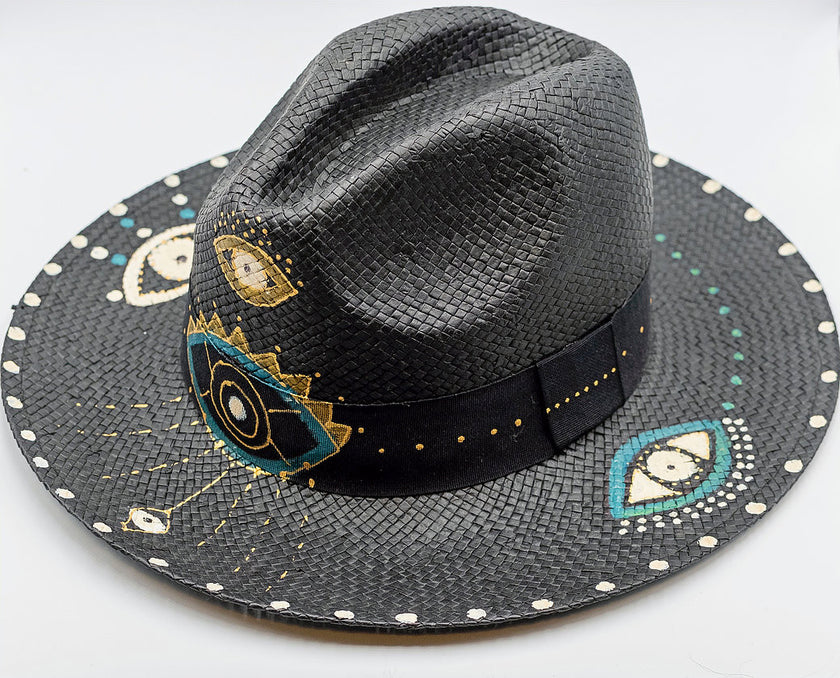 Close up of glam eye, fedora, hand-painted hat in black