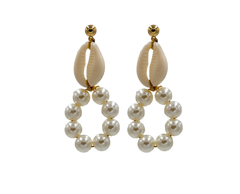Close up of mother of shell, freshwater pearl, hoop earrings
