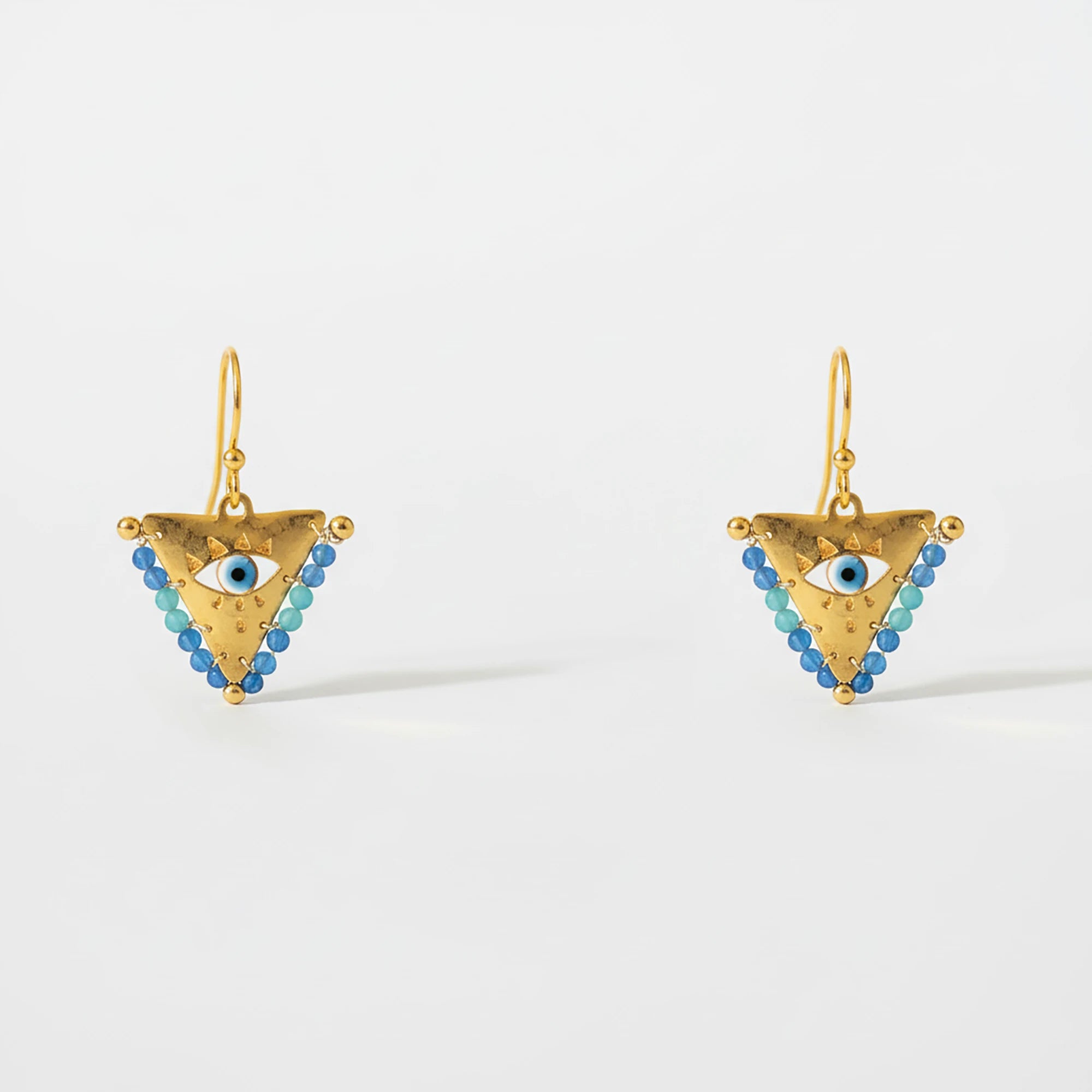 Medium blue fylachto earring in gold plated sterling silver with handpainted blue eye and blue bead details