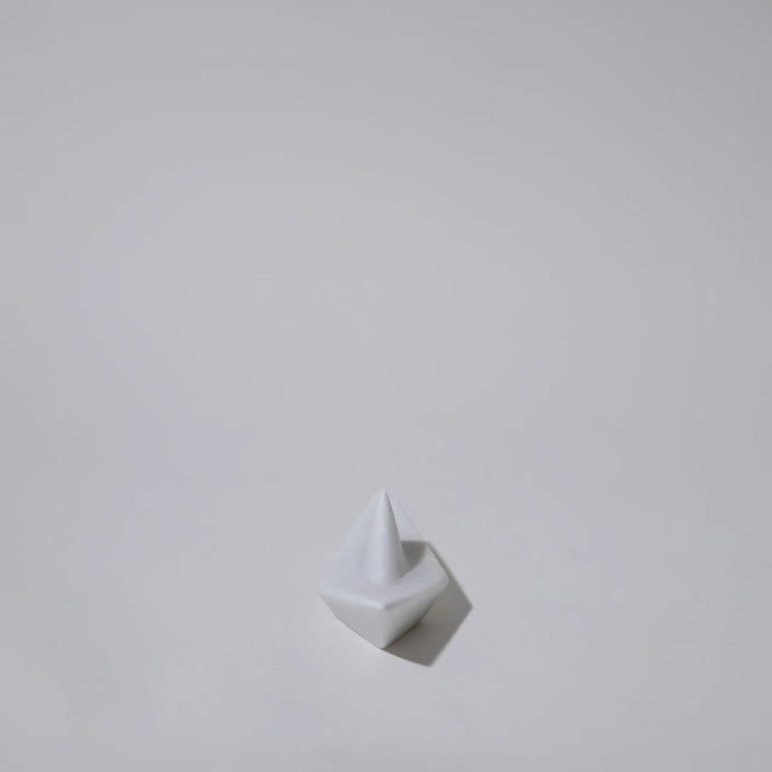 Close up of cycladic naxos marble boat origami sculpture
