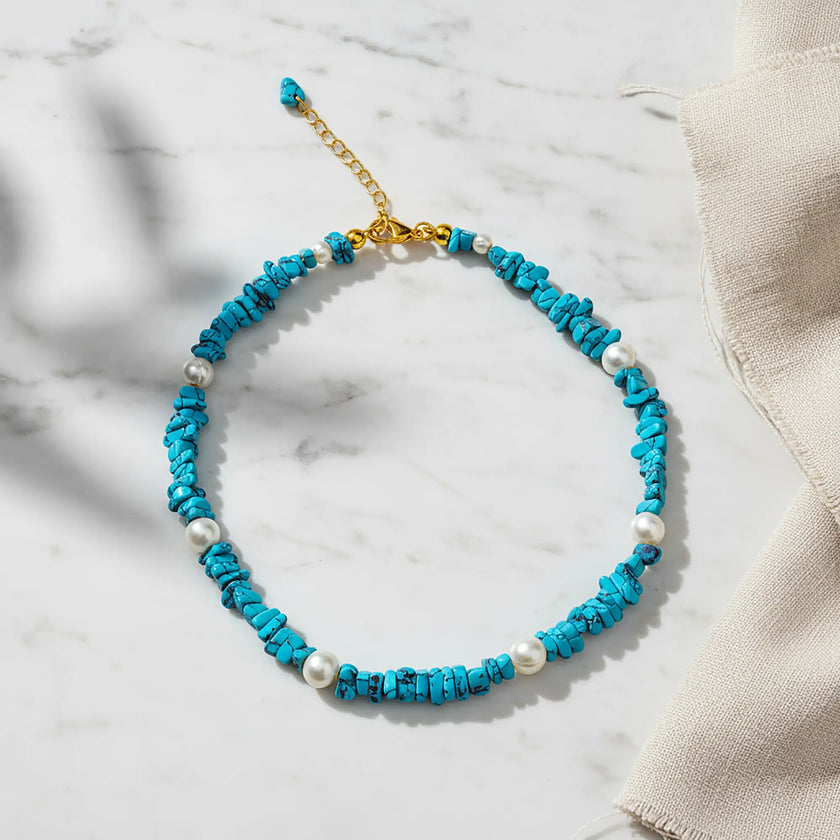 Turquoise chip necklace with pearls and gold tone clasp handcrafted in Greece