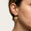 Close up of medium Sunset Reef fylachto earring in gold plated sterling silver with handpainted eye