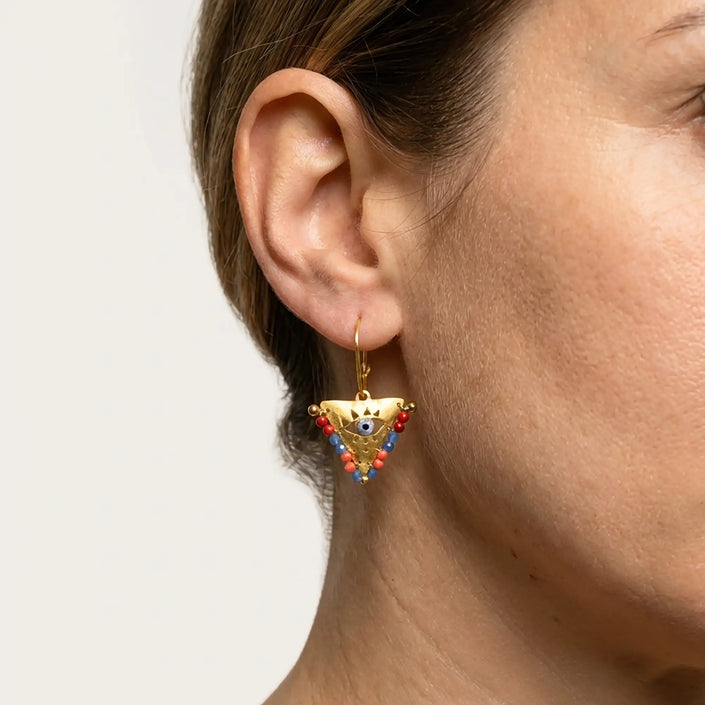 Close up of medium Sunset Reef fylachto earring in gold plated sterling silver with handpainted eye