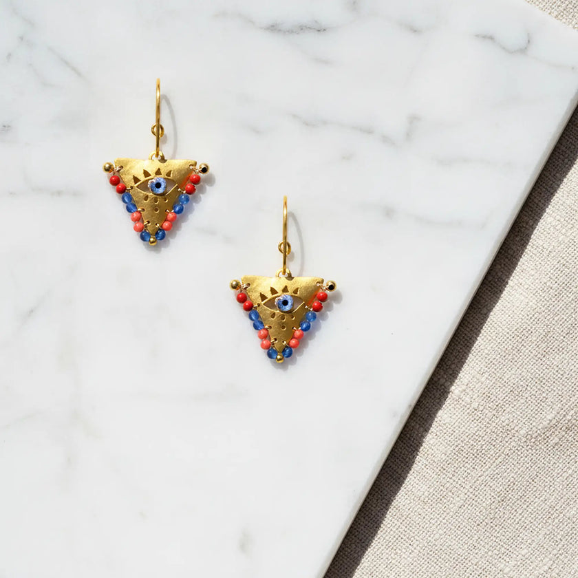 Medium Sunset Reef fylachto earring on marble surface with coral red and ocean blue bead details