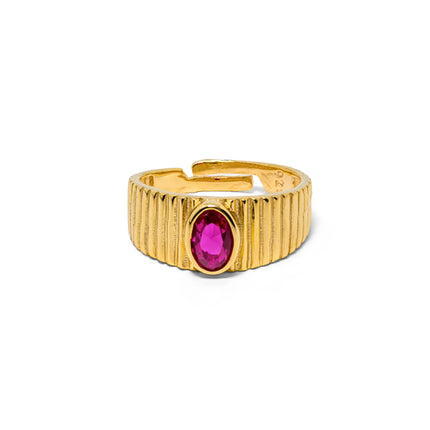 A gold-plated 925 sterling silver adjustable ring with a ribbed, column-like band and a central oval fuchsia-ruby stone.