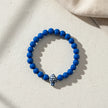 Handmade blue bead bracelet from Naxos with blue and white fish centerpiece