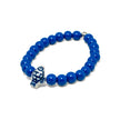 Stretch bracelet with vivid blue beads and Greek fish centerpiece