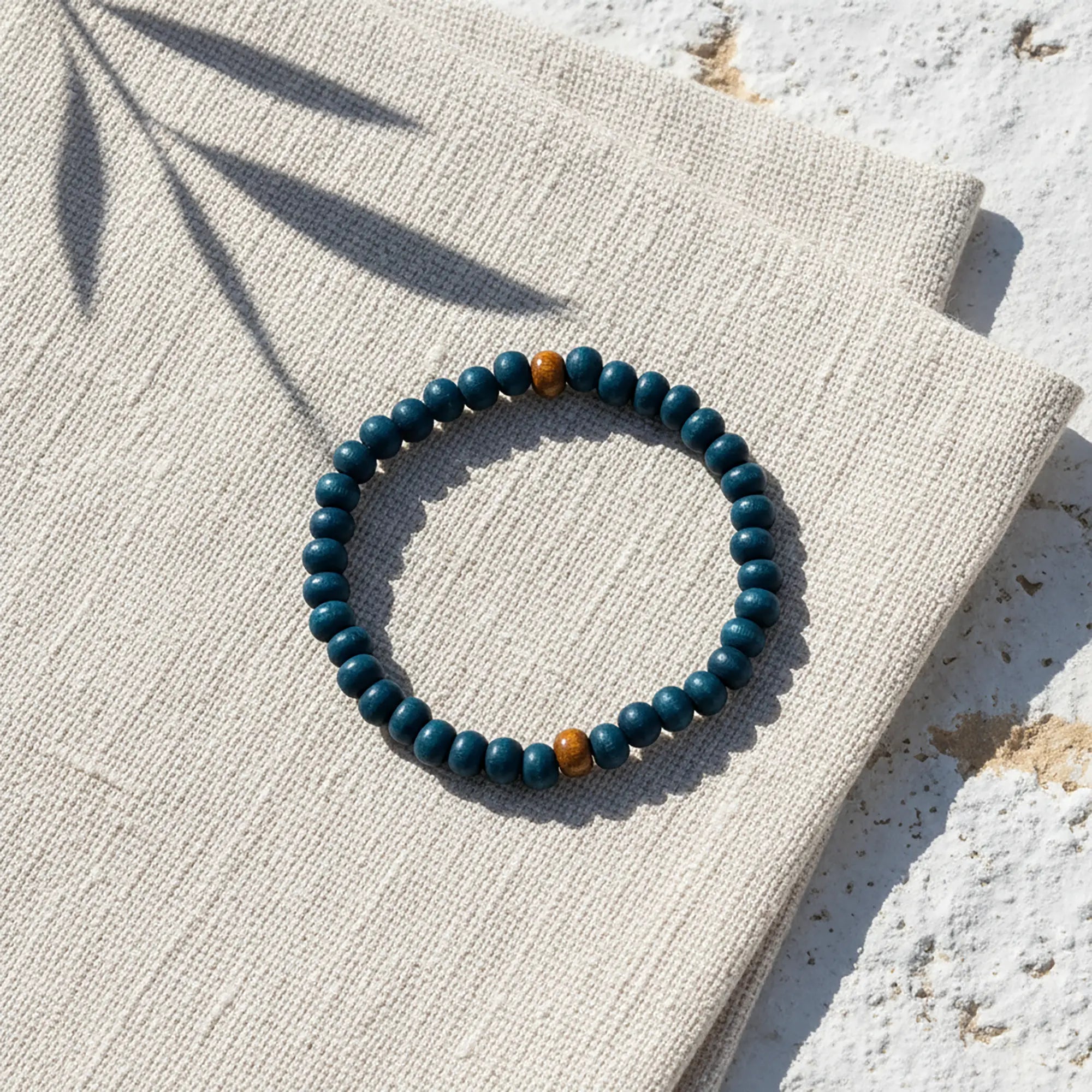 Handmade wooden bead bracelet from Naxos with deep blue beads and natural wooden accents