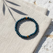 Handmade wooden bead bracelet from Naxos with deep blue beads and natural wooden accents