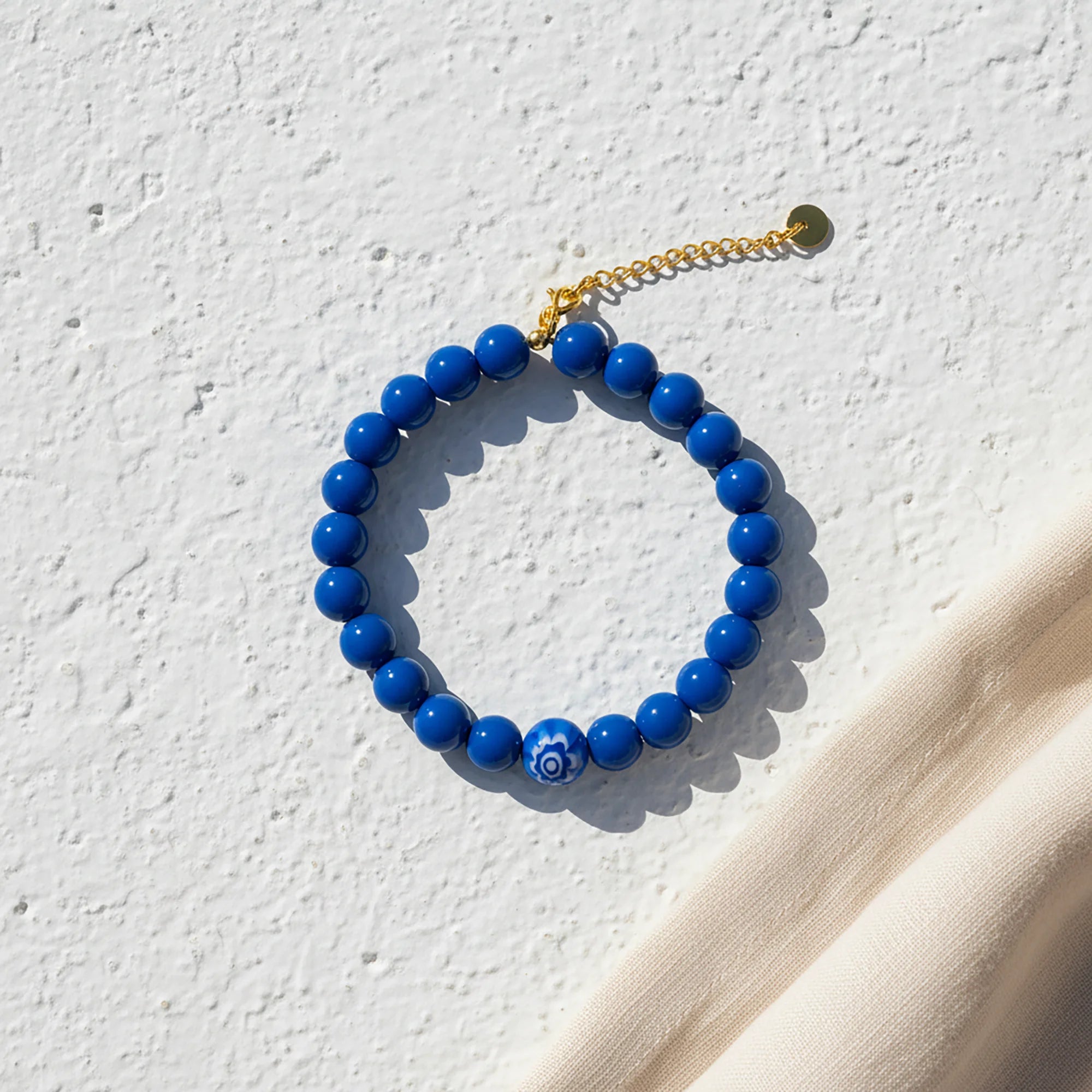 Handmade blue evil eye bracelet from Naxos with vivid blue beads and central mati bead