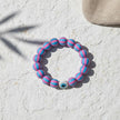 Handmade candy stripe evil eye bracelet from Naxos with pink and blue beads