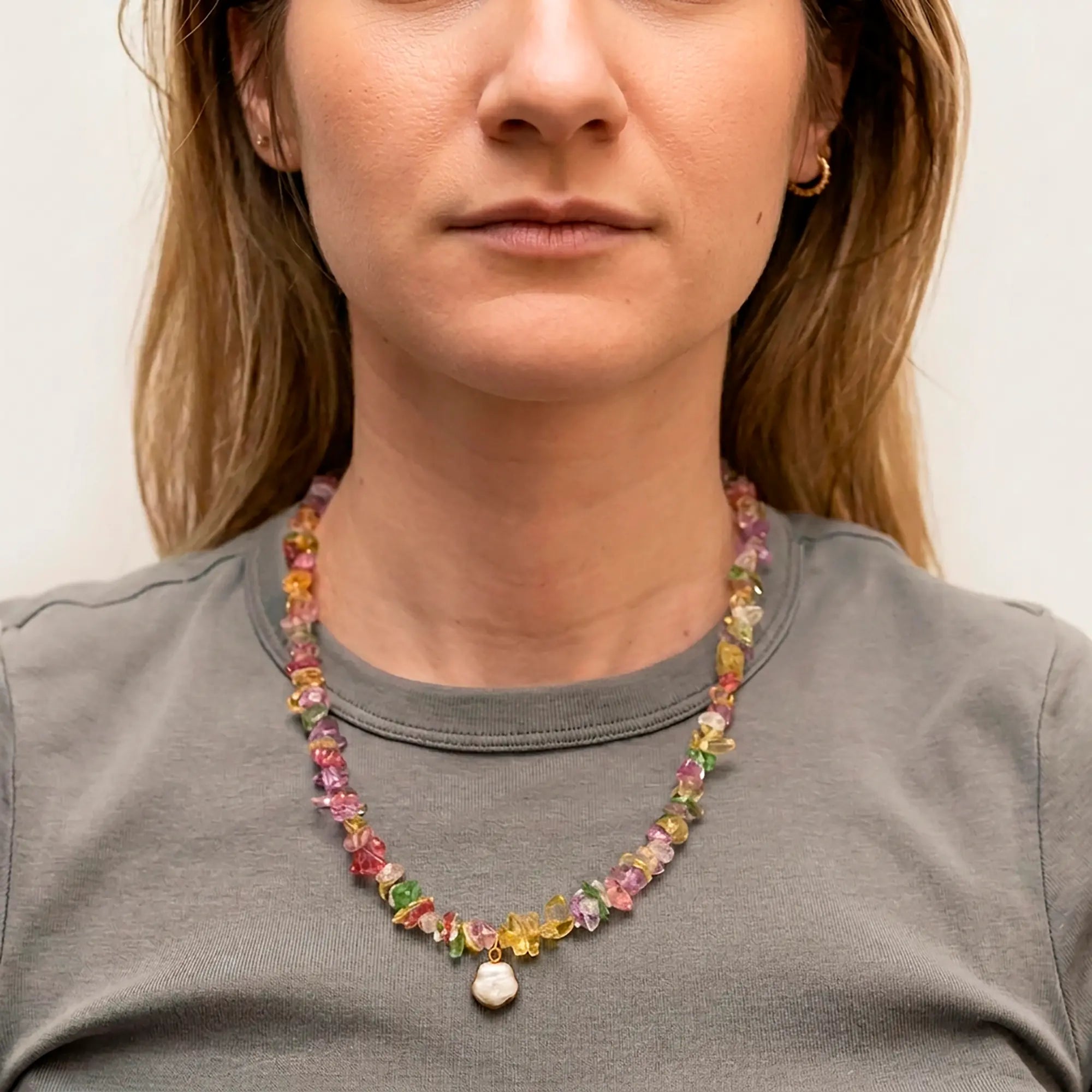 Drosia natural stone necklace with pearl drop worn with grey top