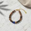 Handmade Murano bracelet from Naxos with marbled brown beads and blue glass centerpiece