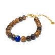 Adjustable bracelet with glossy marbled brown beads, gold veining, and blue Murano centerpiece