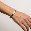 Close up of evil eye bangle bracelet