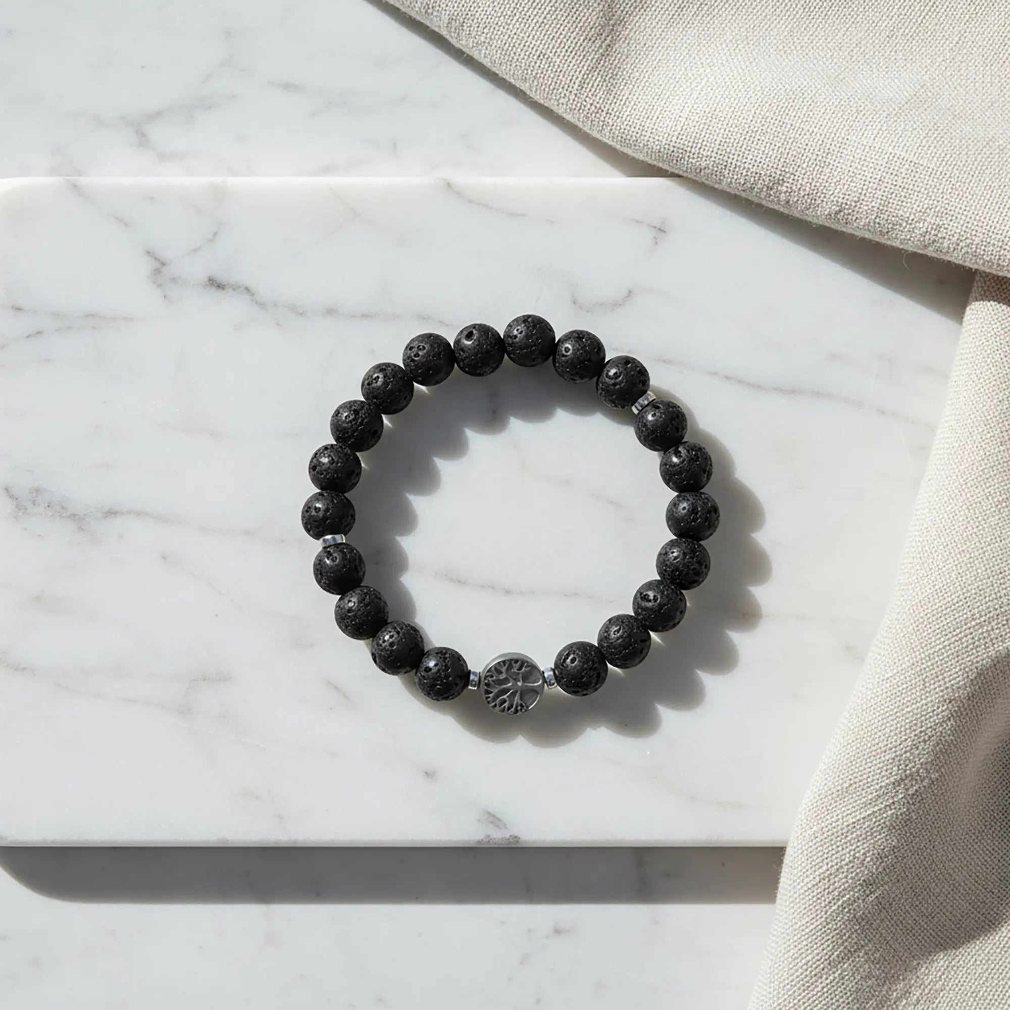 Handmade lava stone bracelet from Naxos with black volcanic beads and tree of life centerpiece