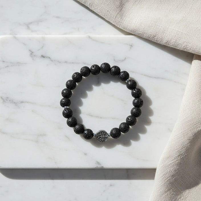 Handmade lava stone bracelet from Naxos with black volcanic beads and tree of life centerpiece