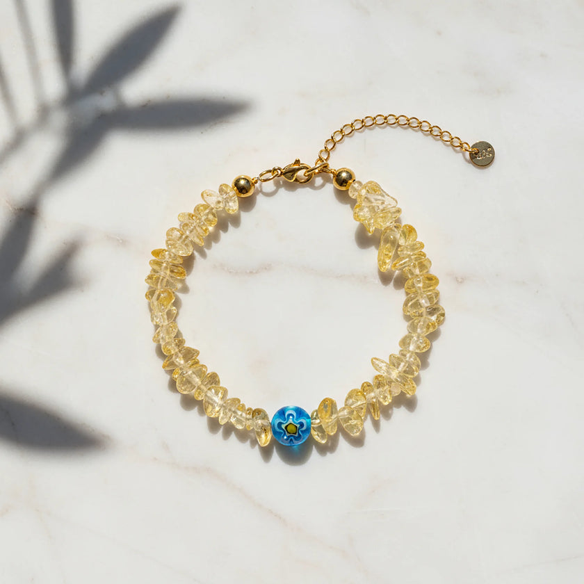 Handmade bracelet from Naxos with golden chip beads and blue Murano glass centerpiece