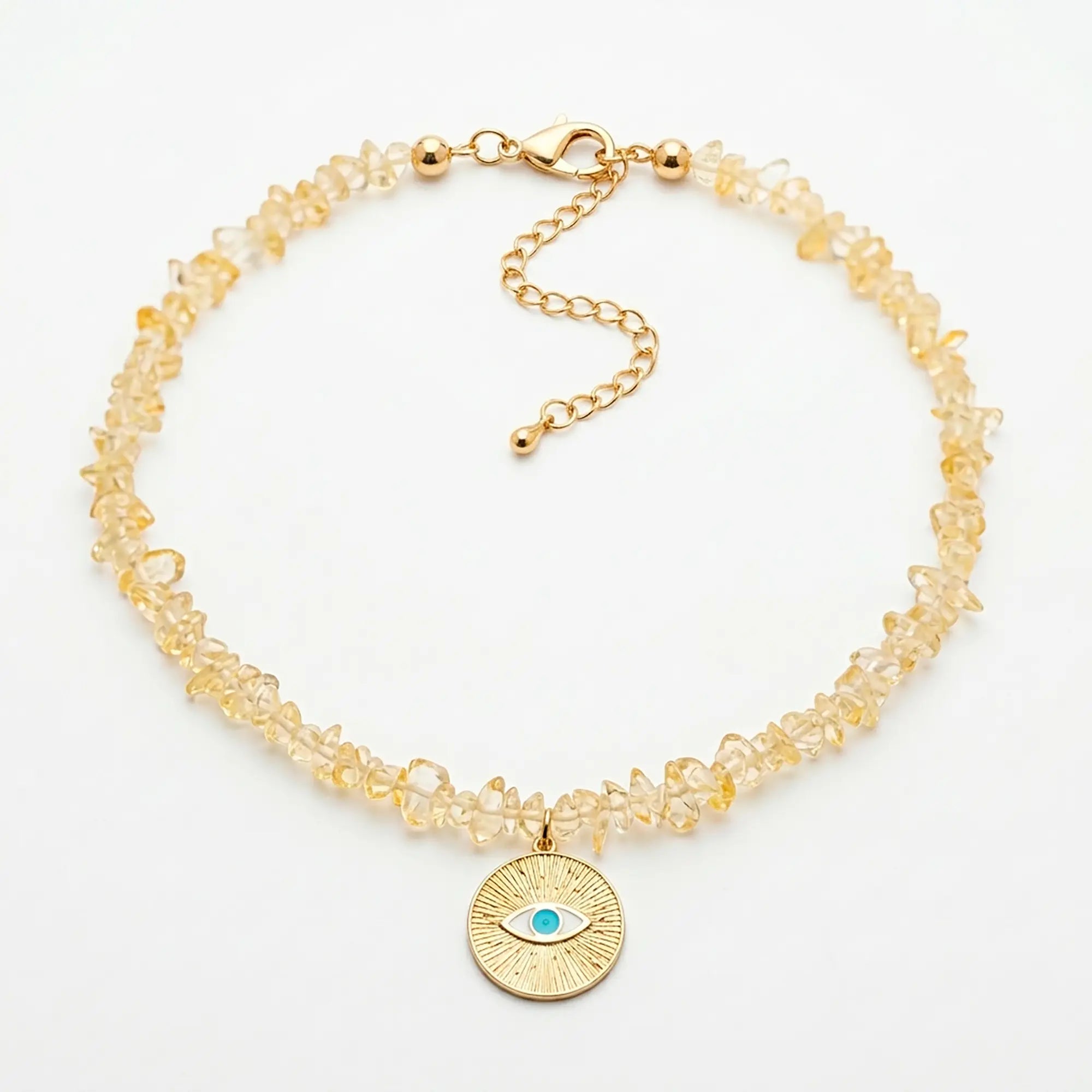 Ilios natural citrine necklace with sunburst evil eye pendant flat lay