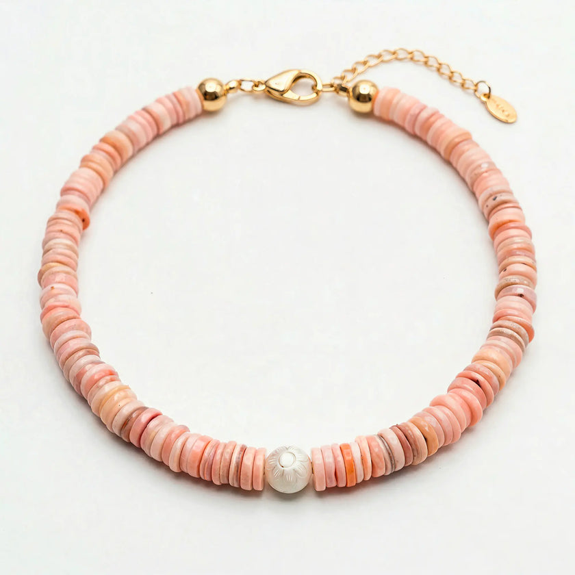 Koralli natural shell disc bead necklace with Murano flower detail, flat lay