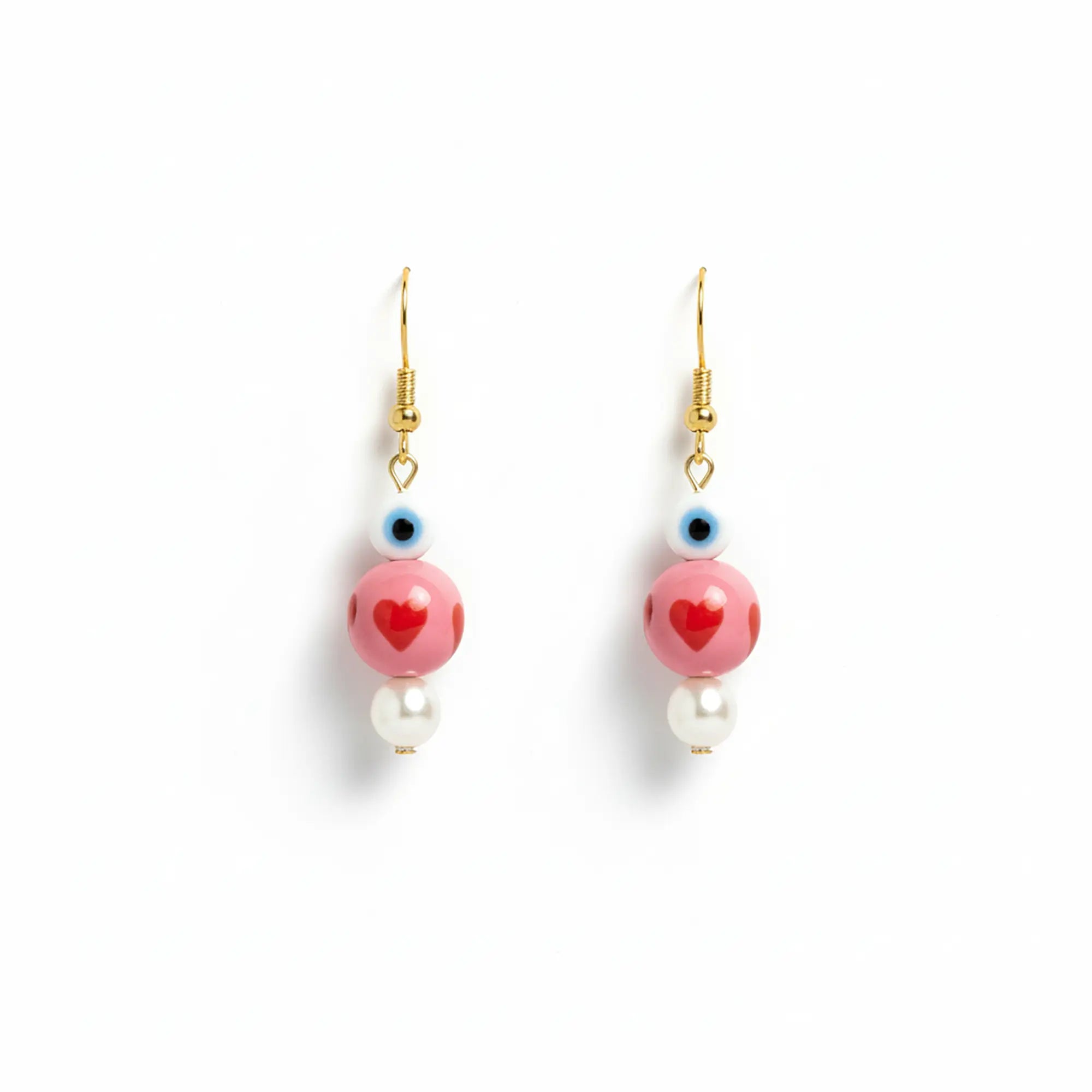 Handmade earrings from Naxos with pink heart beads, evil eye detail, and pearl drops