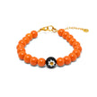Handmade orange bead bracelet from Naxos with Murano glass centerpiece and gold plated adjustable clasp