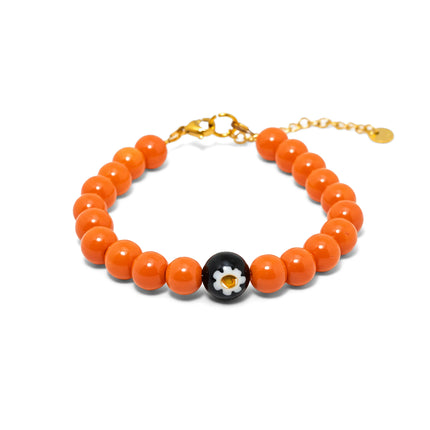 Handmade orange bead bracelet from Naxos with Murano glass centerpiece and gold plated adjustable clasp