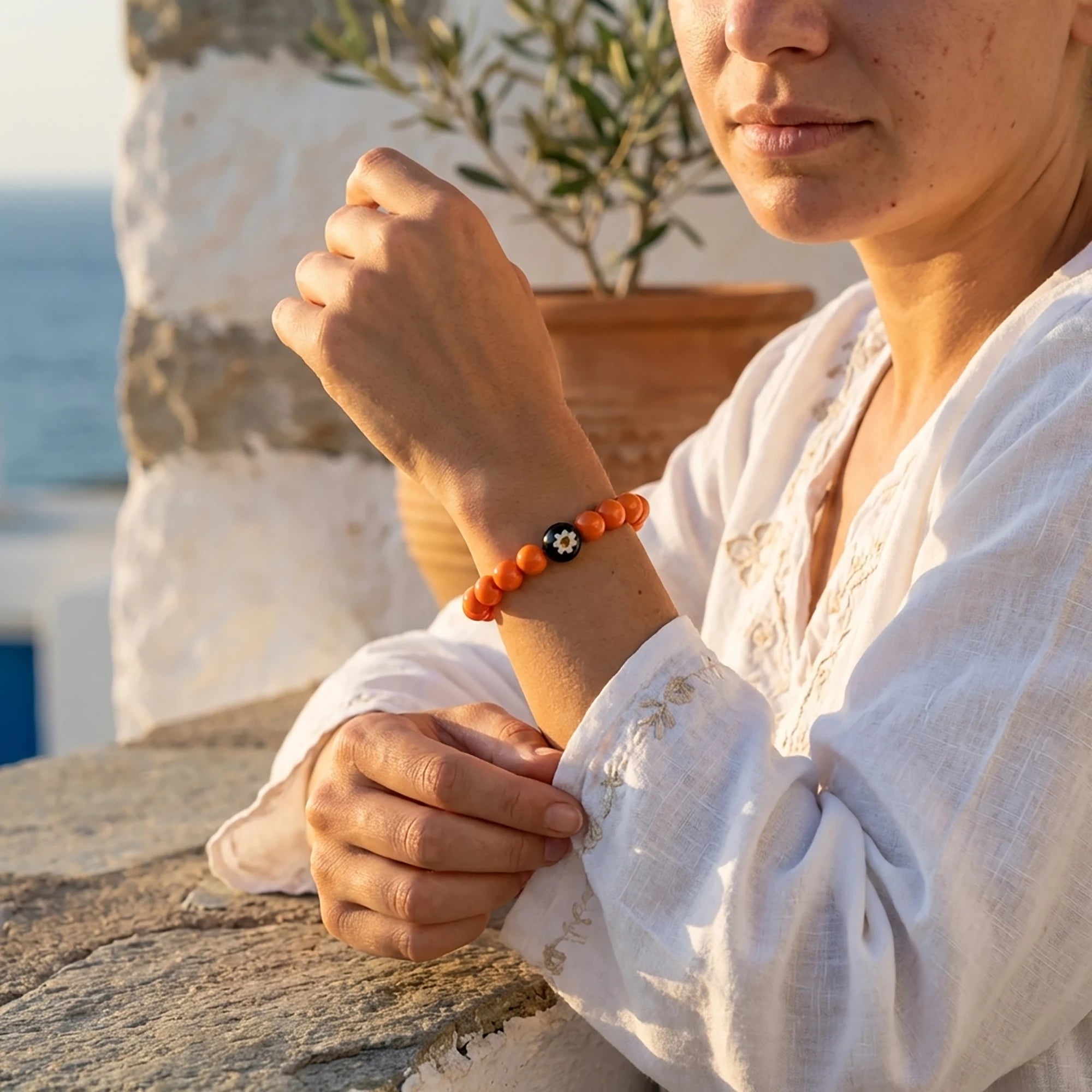 Close up of mati ilios bracelet with murano centerpiece