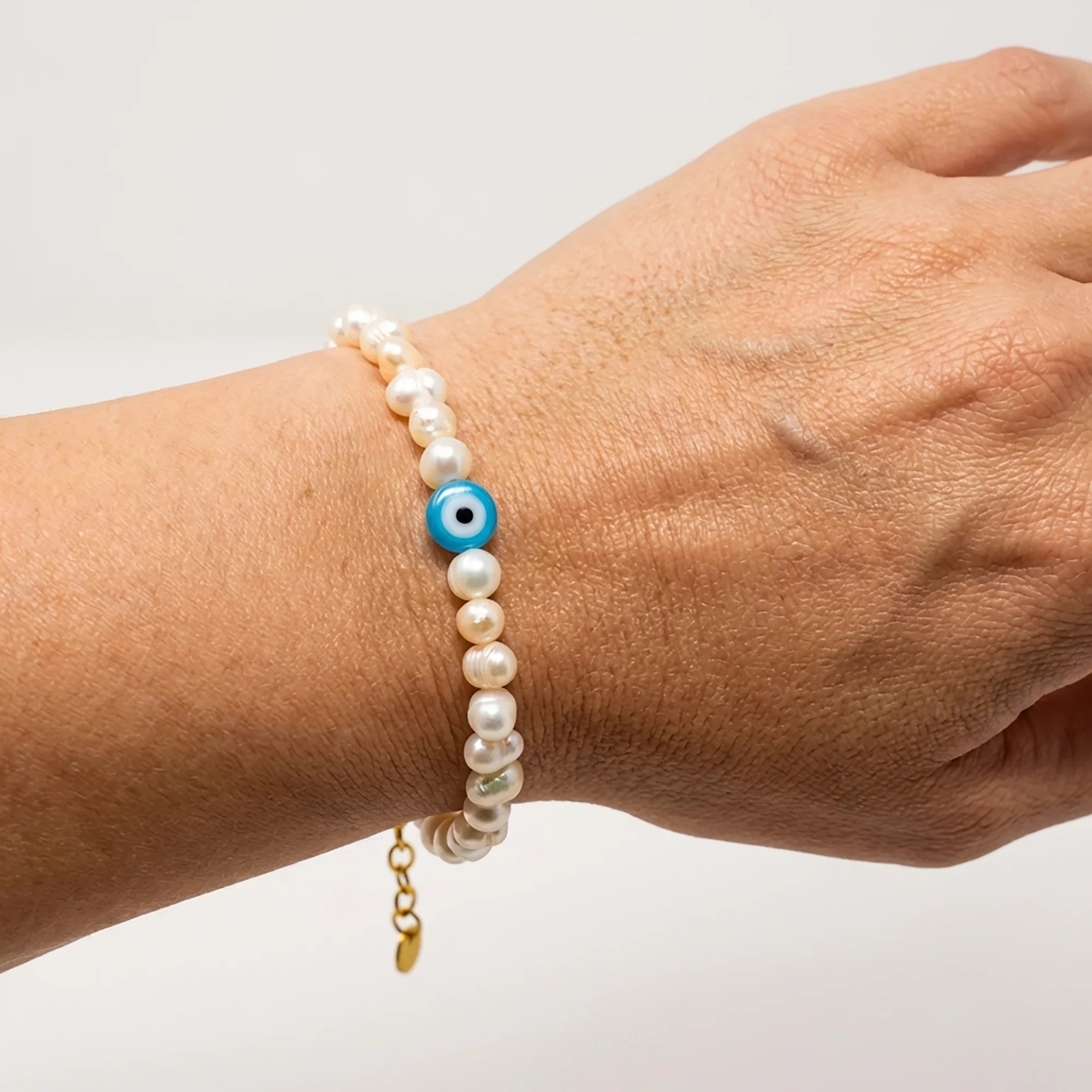 terezas-naxos-pearl-evil-eye-bracelet-on-wrist
