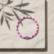 Handmade pink purple and white seed bead bracelet with purple evil eye centrepiece, Naxos