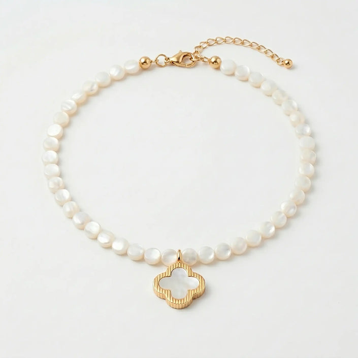 Selini freshwater pearl necklace with shell clover pendant flat lay