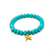 Stretch bracelet with turquoise faceted beads and gold starfish charm