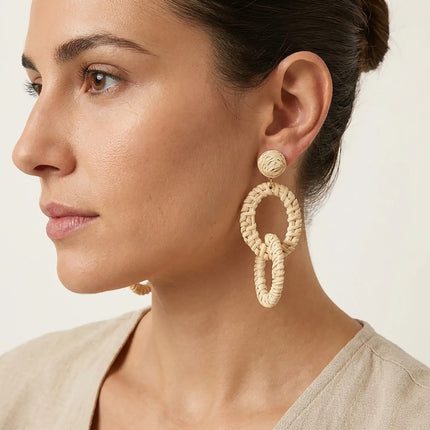 Woman wearing natural woven double oval statement earrings handcrafted in Greece