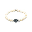 Stretch bracelet with white marbled stone beads and tree of life center detail